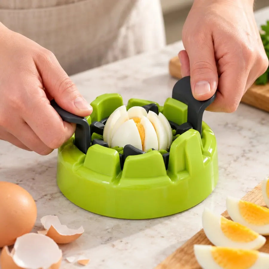 Hands pressing the Götze 2-in-1 Food Divider wire slicer to slice a hard-boiled egg