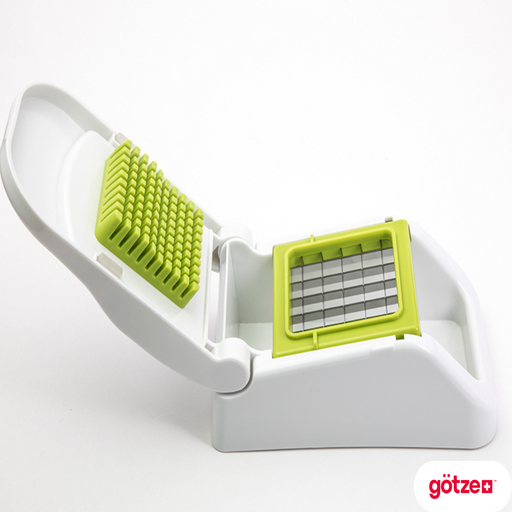Götze FreshCut Food Dicer with white hinged press, green cutting grid, stainless steel blades, and integrated food collection base on a white background.