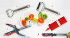 Götze Limited Bundle 5-piece kitchen tool set featuring two stainless steel peelers, a red slicer, multi-function kitchen shears, and a crinkle cutter julienne slicer.