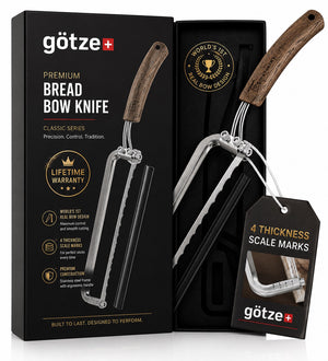 Götze Premium Bread & Sourdough Bow Knife in its black gift box with a wooden handle and stainless steel frame