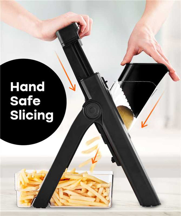 Götze SafeSlice Pro mandoline slicer demonstrating hand-safe slicing with a food holder, adjustable stand, and clear container collecting fresh-cut fries.