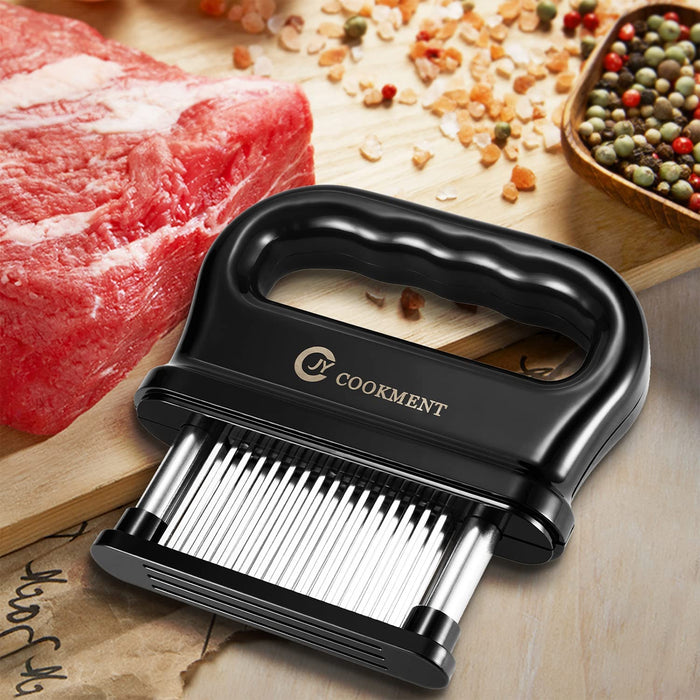 Black 48-blade stainless steel meat tenderizer displayed beside raw steak, coarse salt, and peppercorns on a wooden cutting board.