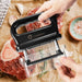 Black 48-blade stainless steel meat tenderizer with ergonomic handle and removable clear protective cover, shown above seasoned raw steaks.