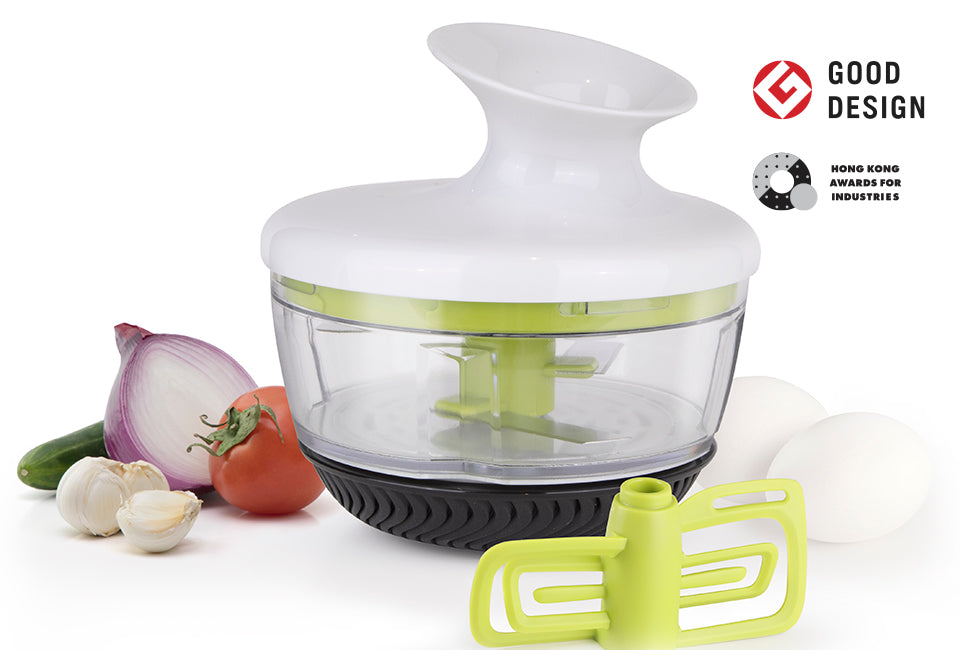 Götze Mavo Sauce Knife with clear container, white ergonomic lid, green chopping blade, mixing attachment, and black non-slip base displayed with fresh ingredients.