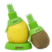 Götze green citrus spritzer attachments inserted into a lemon and kiwi, with matching storage base for spraying fresh fruit juice directly from the fruit.