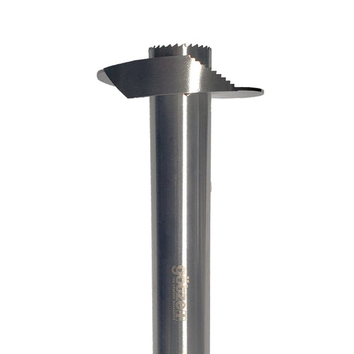Close-up of the Götze stainless steel pineapple corer and slicer showing the serrated circular coring edge and slicing blade.