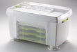 Götze Premium Vegetable Spiralizer storage base with clear protective lid, suction feet, and built-in compartment for organizing interchangeable grater attachments.