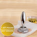 Götze Reversible Dual-Sided Meat Tenderizer & Pounder weighing 1.87 pounds or 847 grams, shown pressing the toothed side into raw meat.