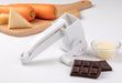 Götze Rotary Grater with hand crank displayed with grated cheese, carrots, chocolate, and a wooden cutting board.