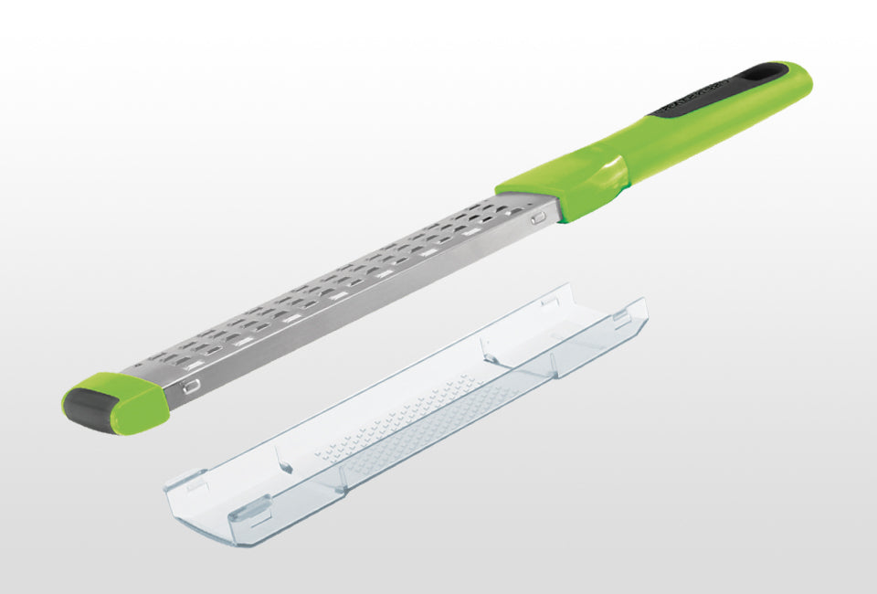 Götze Zester Plus with green ergonomic handle and clear protective cover, designed for zesting and fine grating.