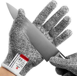 Premium Cut Resistant Glove protecting the hand while holding a sharp kitchen knife, designed for safer slicing, chopping, and food preparation.