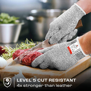 Premium Cut Resistant Glove worn while slicing raw meat with a chef knife, providing hand protection during food preparation.