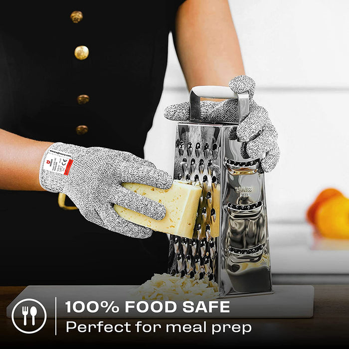 Premium Cut Resistant Glove worn while grating cheese with a stainless steel box grater for safer food preparation.