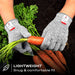 Premium Cut Resistant Glove worn while trimming fresh carrots, featuring a lightweight, snug, and comfortable fit for gardening and food prep.