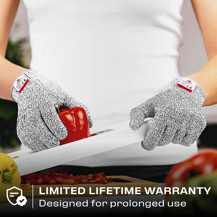 Premium Cut Resistant Glove worn while slicing a red bell pepper, designed for prolonged food preparation use with a limited lifetime warranty.