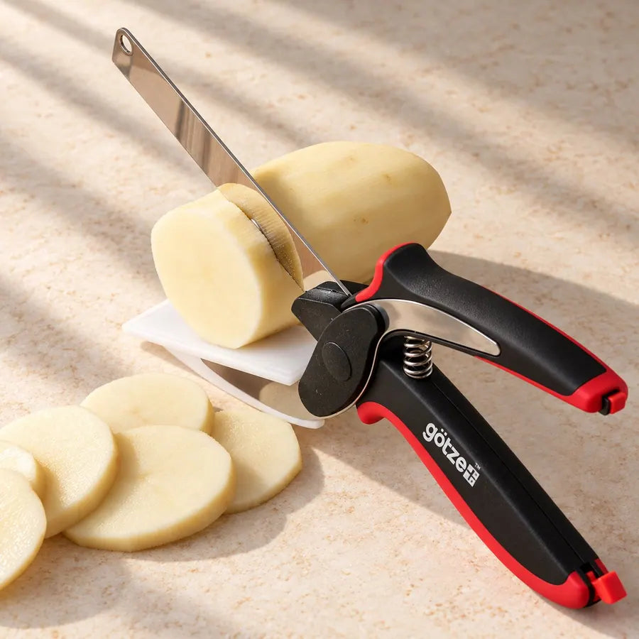 Götze 3-in-1 Kitchen Shears slicing a peeled potato beside potato slices