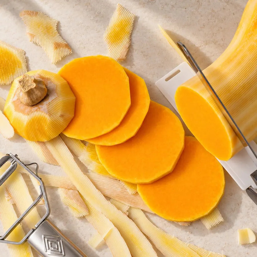 Golden butternut squash slices and peel strips with the Götze shears blade